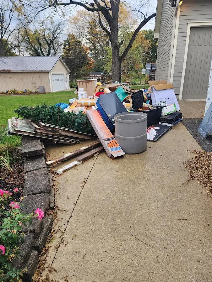 Dumpster being loaded with debris for Estate Cleanout Dumpster Rental in National City